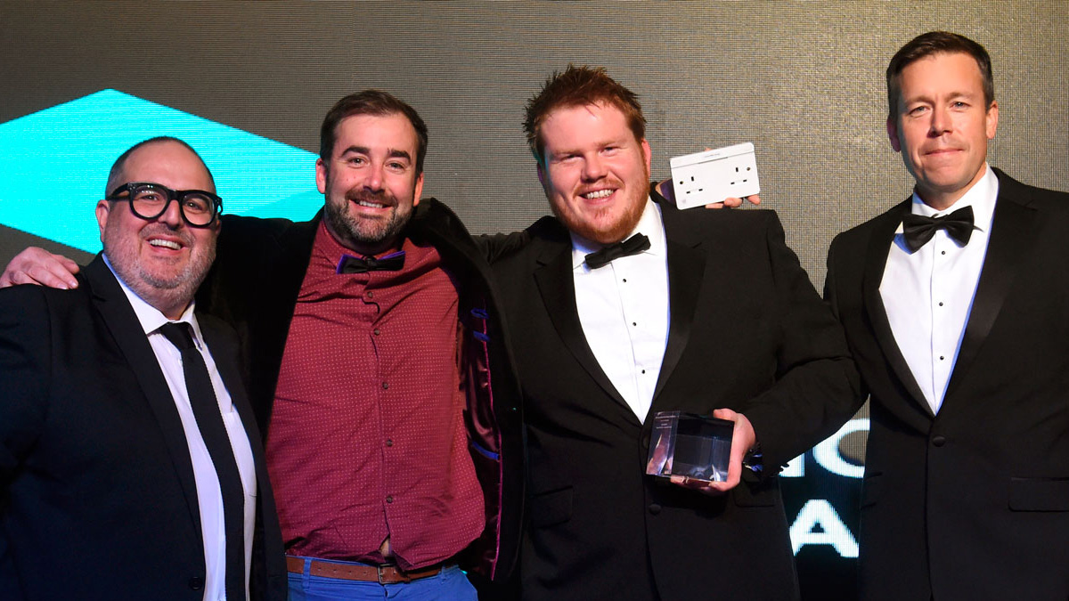 Co-Founders, Dan and Josh, posing with a trophy.